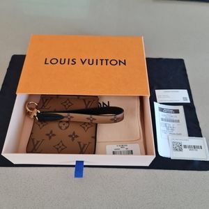 Louis vuitton reverse monogram trio pouch and wristlet